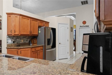 This beautifully designed concrete block stucco home stands out on The Grand Club Cypress Course in Florida - for sale on GolfHomes.com, golf home, golf lot