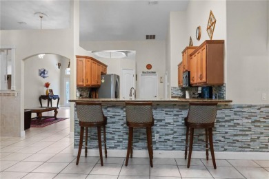 This beautifully designed concrete block stucco home stands out on The Grand Club Cypress Course in Florida - for sale on GolfHomes.com, golf home, golf lot