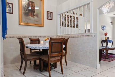 This beautifully designed concrete block stucco home stands out on The Grand Club Cypress Course in Florida - for sale on GolfHomes.com, golf home, golf lot