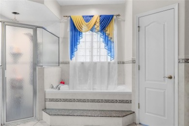 This beautifully designed concrete block stucco home stands out on The Grand Club Cypress Course in Florida - for sale on GolfHomes.com, golf home, golf lot