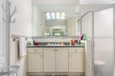 This beautifully designed concrete block stucco home stands out on The Grand Club Cypress Course in Florida - for sale on GolfHomes.com, golf home, golf lot