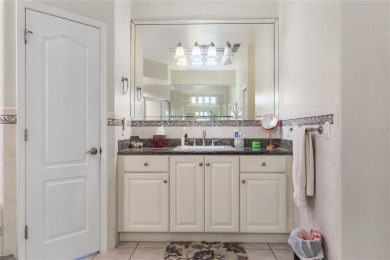 This beautifully designed concrete block stucco home stands out on The Grand Club Cypress Course in Florida - for sale on GolfHomes.com, golf home, golf lot