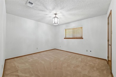 Recently refreshed with paint, this lovely one owner home awaits on Texas Rangers Golf Club  in Texas - for sale on GolfHomes.com, golf home, golf lot