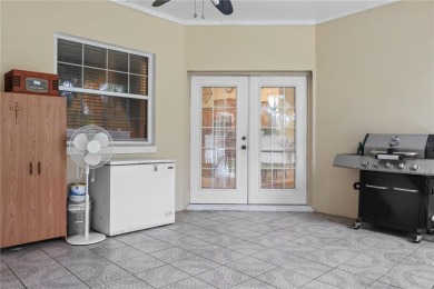 This beautifully designed concrete block stucco home stands out on The Grand Club Cypress Course in Florida - for sale on GolfHomes.com, golf home, golf lot