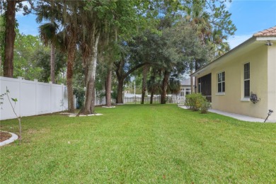 This beautifully designed concrete block stucco home stands out on The Grand Club Cypress Course in Florida - for sale on GolfHomes.com, golf home, golf lot