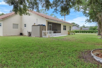 This beautifully designed concrete block stucco home stands out on The Grand Club Cypress Course in Florida - for sale on GolfHomes.com, golf home, golf lot