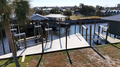 Check out this Canalfront lot with 2 NEWLY BUILT BOAT SLIPS! on  in Florida - for sale on GolfHomes.com, golf home, golf lot