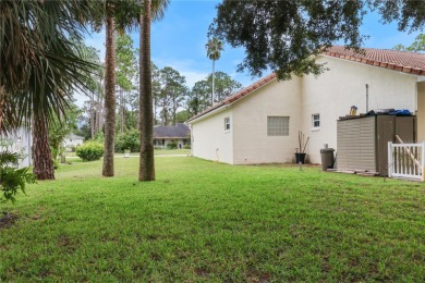 This beautifully designed concrete block stucco home stands out on The Grand Club Cypress Course in Florida - for sale on GolfHomes.com, golf home, golf lot