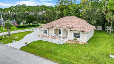 This beautifully designed concrete block stucco home stands out on The Grand Club Cypress Course in Florida - for sale on GolfHomes.com, golf home, golf lot