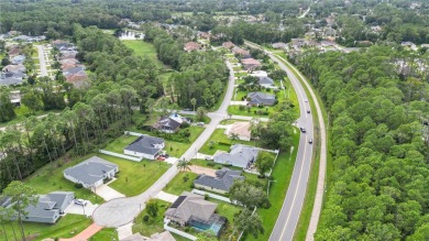 This beautifully designed concrete block stucco home stands out on The Grand Club Cypress Course in Florida - for sale on GolfHomes.com, golf home, golf lot