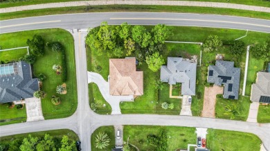 This beautifully designed concrete block stucco home stands out on The Grand Club Cypress Course in Florida - for sale on GolfHomes.com, golf home, golf lot