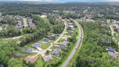 This beautifully designed concrete block stucco home stands out on The Grand Club Cypress Course in Florida - for sale on GolfHomes.com, golf home, golf lot