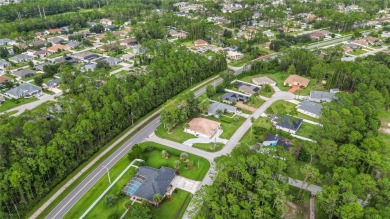 This beautifully designed concrete block stucco home stands out on The Grand Club Cypress Course in Florida - for sale on GolfHomes.com, golf home, golf lot