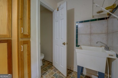 Year-round big water views of Jackson Lake!! This 3-bedroom & 2 on Turtle Cove Golf Course in Georgia - for sale on GolfHomes.com, golf home, golf lot