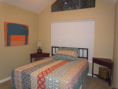 Remarkable 3-2 home situated on three lots, combined for a total on Holly Lake Ranch Golf Club in Texas - for sale on GolfHomes.com, golf home, golf lot