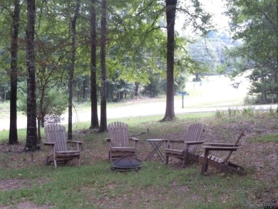 Remarkable 3-2 home situated on three lots, combined for a total on Holly Lake Ranch Golf Club in Texas - for sale on GolfHomes.com, golf home, golf lot