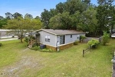 Welcome to this beautifully updated double wide mobile home on Diamondhead Country Club in Mississippi - for sale on GolfHomes.com, golf home, golf lot