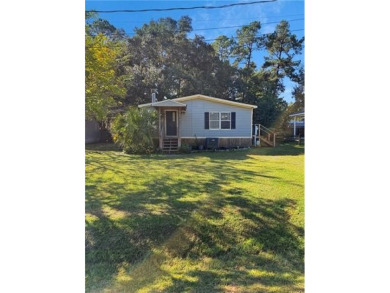 Welcome to this beautifully updated double wide mobile home on Diamondhead Country Club in Mississippi - for sale on GolfHomes.com, golf home, golf lot