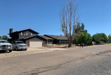 An extraordinary 5-bedroom, 6-bathroom unique tri-level home on Desert Hawk At Pueblo West in Colorado - for sale on GolfHomes.com, golf home, golf lot