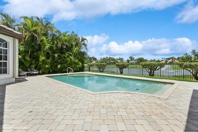 CUSTOM ESTATE HOME WITH 4BR PLUS OFFICE/4.1 BATHS LOCATED ON A on  in Florida - for sale on GolfHomes.com, golf home, golf lot