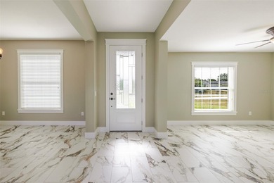 One or more photos have been virtually staged.  NEW CONSTRUCTION on Oyster Creek Golf Club in Florida - for sale on GolfHomes.com, golf home, golf lot