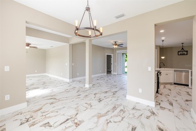 One or more photos have been virtually staged.  NEW CONSTRUCTION on Oyster Creek Golf Club in Florida - for sale on GolfHomes.com, golf home, golf lot