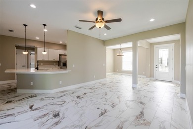 One or more photos have been virtually staged.  NEW CONSTRUCTION on Oyster Creek Golf Club in Florida - for sale on GolfHomes.com, golf home, golf lot