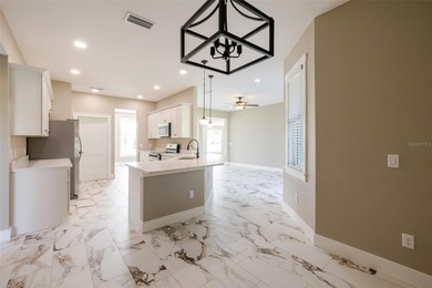 One or more photos have been virtually staged.  NEW CONSTRUCTION on Oyster Creek Golf Club in Florida - for sale on GolfHomes.com, golf home, golf lot