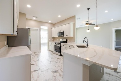 One or more photos have been virtually staged.  NEW CONSTRUCTION on Oyster Creek Golf Club in Florida - for sale on GolfHomes.com, golf home, golf lot