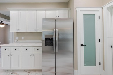 One or more photos have been virtually staged.  NEW CONSTRUCTION on Oyster Creek Golf Club in Florida - for sale on GolfHomes.com, golf home, golf lot