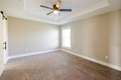 One or more photos have been virtually staged.  NEW CONSTRUCTION on Oyster Creek Golf Club in Florida - for sale on GolfHomes.com, golf home, golf lot