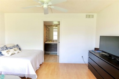Discover serenity in this beautifully renovated 2-bed, 2-bath on Sunrise Lakes Phase III in Florida - for sale on GolfHomes.com, golf home, golf lot