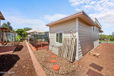 This PERFECTLY located 2 bed 2 bath home Across from the Fairway on Juniper Ridge R.V. Golf Resort in Arizona - for sale on GolfHomes.com, golf home, golf lot