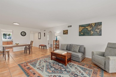 Enjoy resort-style living in this beautiful upper-level corner on Rancho Bernardo Inn Golf Course in California - for sale on GolfHomes.com, golf home, golf lot