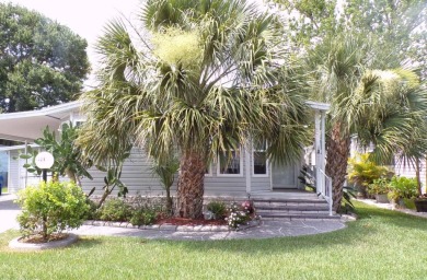 Discover the charm of this beautiful 2-bedroom Palm Harbor home on Schalamar Creek Golf and Country Club in Florida - for sale on GolfHomes.com, golf home, golf lot