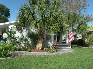 Discover the charm of this beautiful 2-bedroom Palm Harbor home on Schalamar Creek Golf and Country Club in Florida - for sale on GolfHomes.com, golf home, golf lot