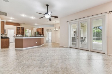 Location, Location - Tampa Palms beauty. This 4/3/2 plus a den on Tampa Palms Golf and Country Club in Florida - for sale on GolfHomes.com, golf home, golf lot