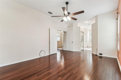 Location, Location - Tampa Palms beauty. This 4/3/2 plus a den on Tampa Palms Golf and Country Club in Florida - for sale on GolfHomes.com, golf home, golf lot