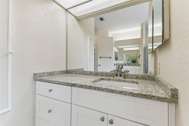 Location, Location - Tampa Palms beauty. This 4/3/2 plus a den on Tampa Palms Golf and Country Club in Florida - for sale on GolfHomes.com, golf home, golf lot