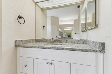Location, Location - Tampa Palms beauty. This 4/3/2 plus a den on Tampa Palms Golf and Country Club in Florida - for sale on GolfHomes.com, golf home, golf lot