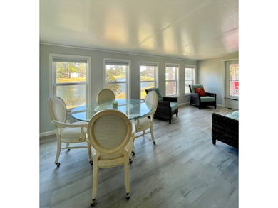 Stunning, move-in-ready manufactured home on leased land-nothing on Pine Lakes Country Club in Florida - for sale on GolfHomes.com, golf home, golf lot