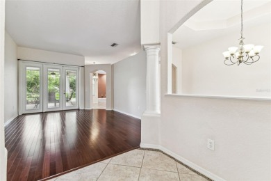 Location, Location - Tampa Palms beauty. This 4/3/2 plus a den on Tampa Palms Golf and Country Club in Florida - for sale on GolfHomes.com, golf home, golf lot