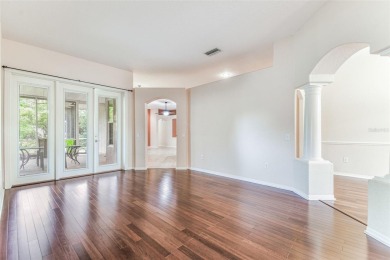 Location, Location - Tampa Palms beauty. This 4/3/2 plus a den on Tampa Palms Golf and Country Club in Florida - for sale on GolfHomes.com, golf home, golf lot