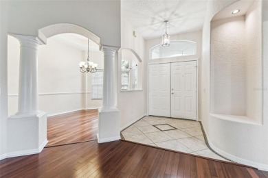 Location, Location - Tampa Palms beauty. This 4/3/2 plus a den on Tampa Palms Golf and Country Club in Florida - for sale on GolfHomes.com, golf home, golf lot