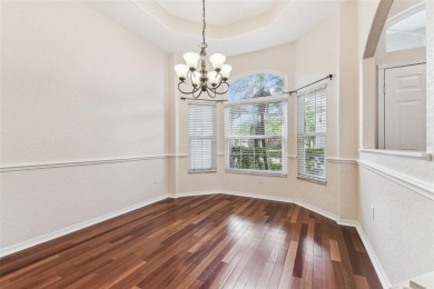 Location, Location - Tampa Palms beauty. This 4/3/2 plus a den on Tampa Palms Golf and Country Club in Florida - for sale on GolfHomes.com, golf home, golf lot