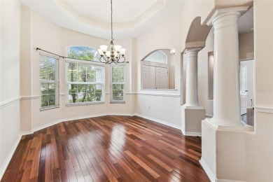 Location, Location - Tampa Palms beauty. This 4/3/2 plus a den on Tampa Palms Golf and Country Club in Florida - for sale on GolfHomes.com, golf home, golf lot