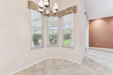 Location, Location - Tampa Palms beauty. This 4/3/2 plus a den on Tampa Palms Golf and Country Club in Florida - for sale on GolfHomes.com, golf home, golf lot