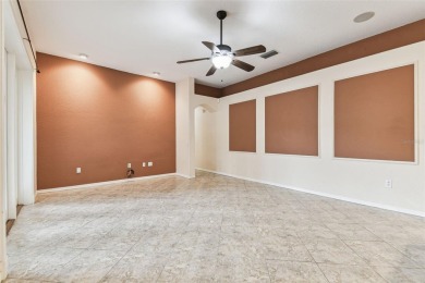 Location, Location - Tampa Palms beauty. This 4/3/2 plus a den on Tampa Palms Golf and Country Club in Florida - for sale on GolfHomes.com, golf home, golf lot