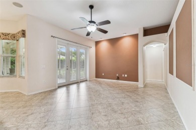 Location, Location - Tampa Palms beauty. This 4/3/2 plus a den on Tampa Palms Golf and Country Club in Florida - for sale on GolfHomes.com, golf home, golf lot
