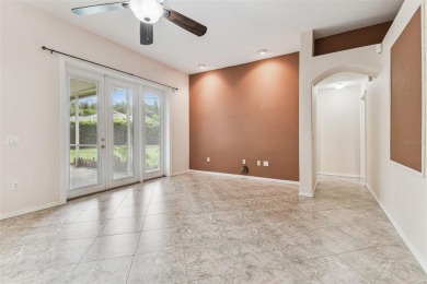 Location, Location - Tampa Palms beauty. This 4/3/2 plus a den on Tampa Palms Golf and Country Club in Florida - for sale on GolfHomes.com, golf home, golf lot